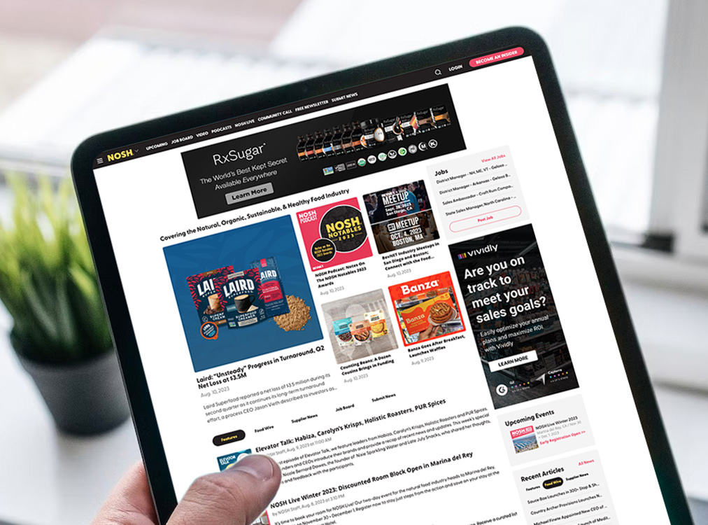 A reader browsing Nosh.com on a laptop