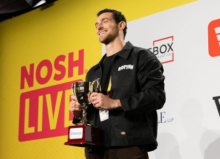 A Nosh Live Pitch Slam competitor on the main stage